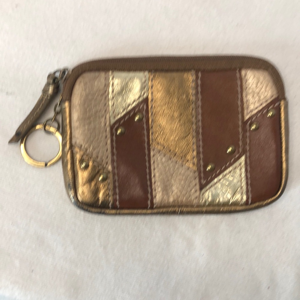 FOSSIL mini gold and brown leather change purse with gold studs.